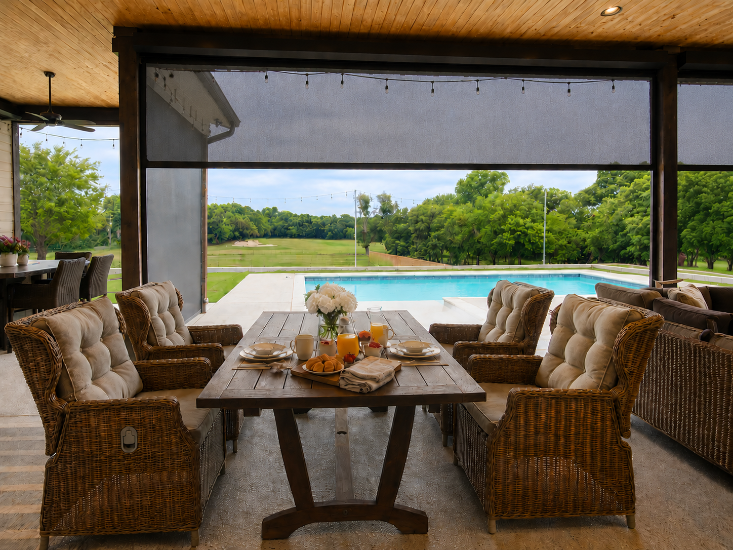 A beautifully set outdoor breakfast table on a covered architectural terrace